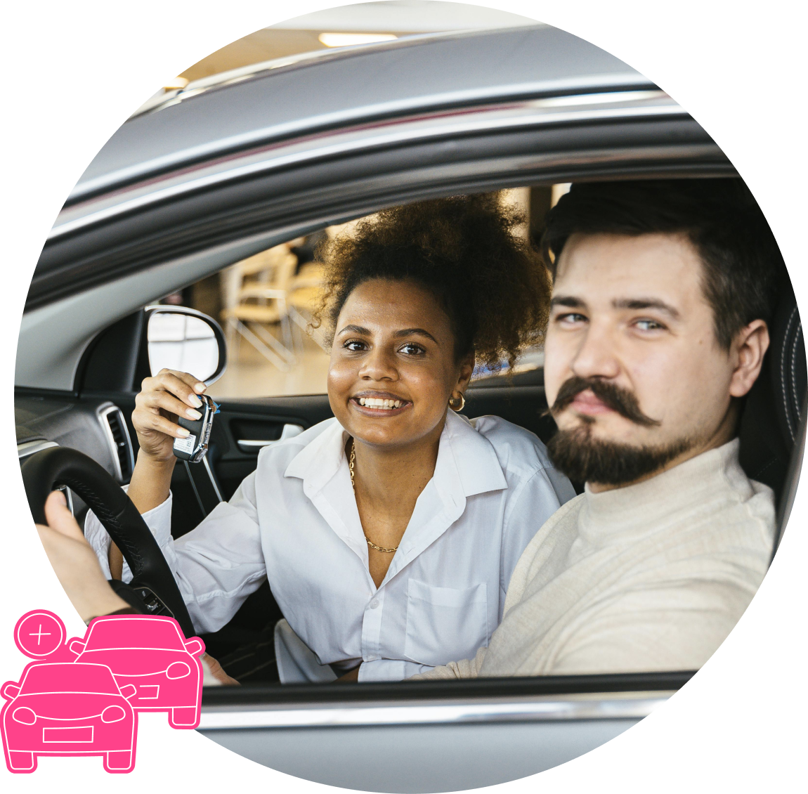 A couple smiling to camera, sitting in a car